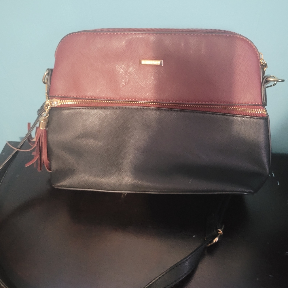 Two-Tone Burgundy and Black Crossbody Bag with Tassel Accent